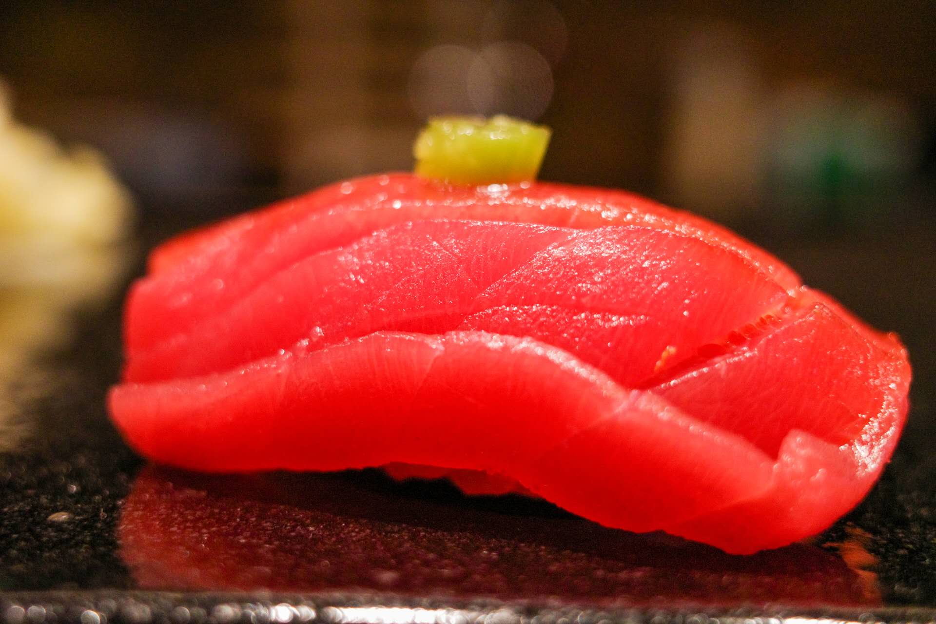 Seared toro nigiri after live torch performance