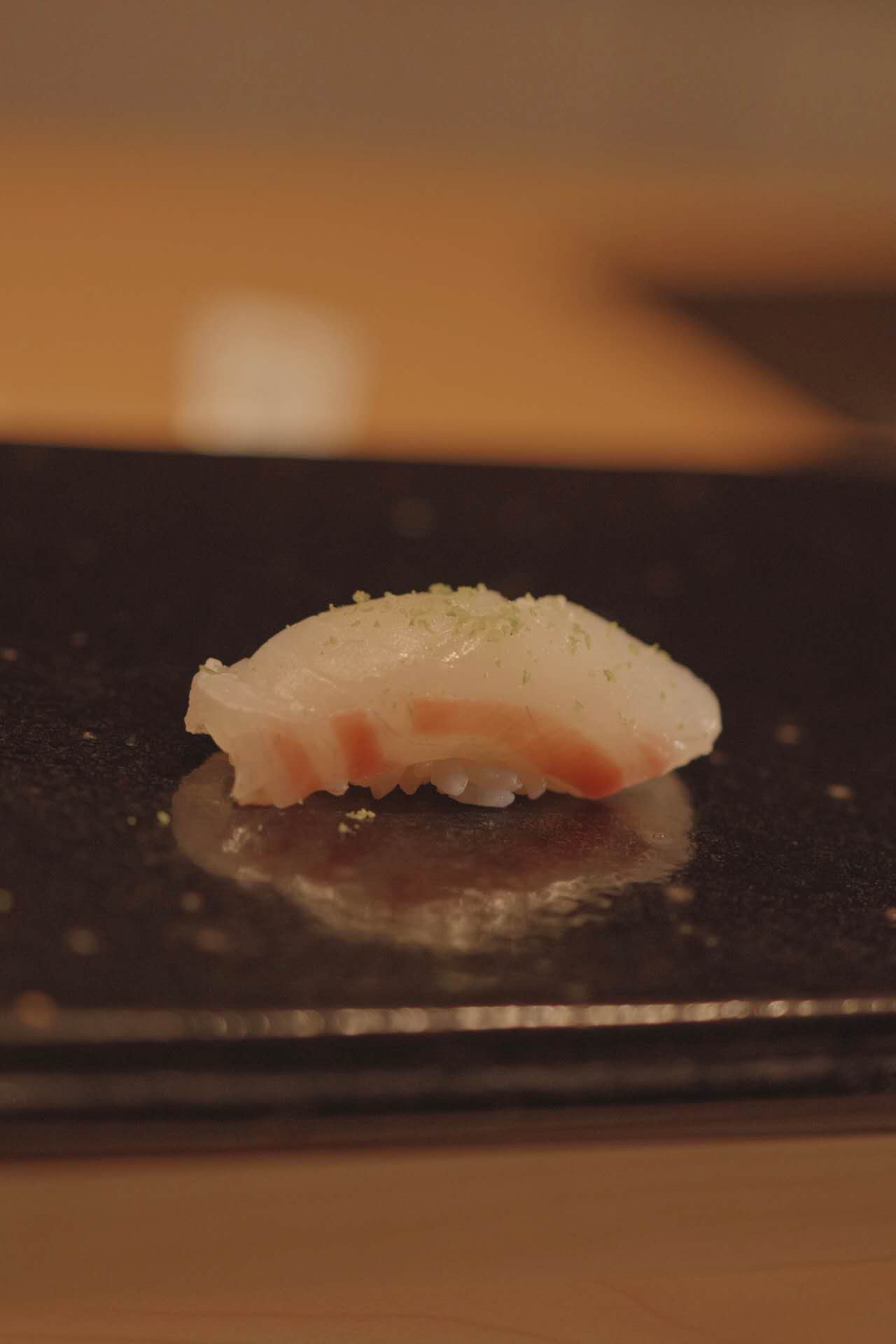 White fish nigiri with yuzu from live sushi performance